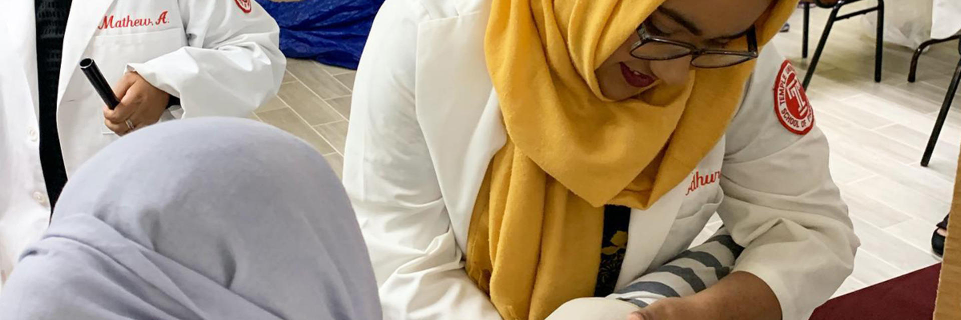PharmD student performing clinical work on patient