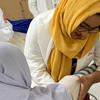 PharmD student performing clinical work on patient